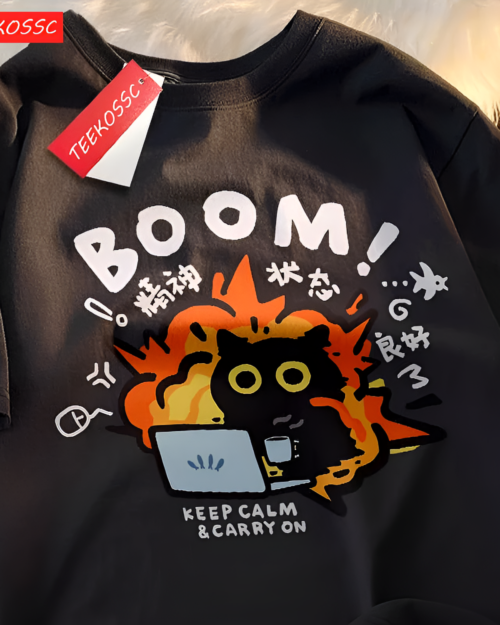 Close-up of a black t-shirt featuring the Chaos Neko Explosion Tee design with a cat and text.