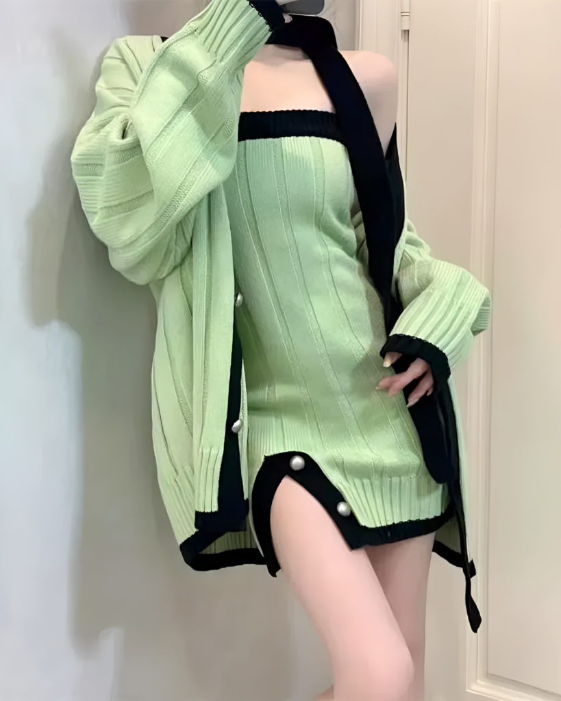 Green chunky knit dress with cardigan, featuring ribbed detailing and a choker neckline.