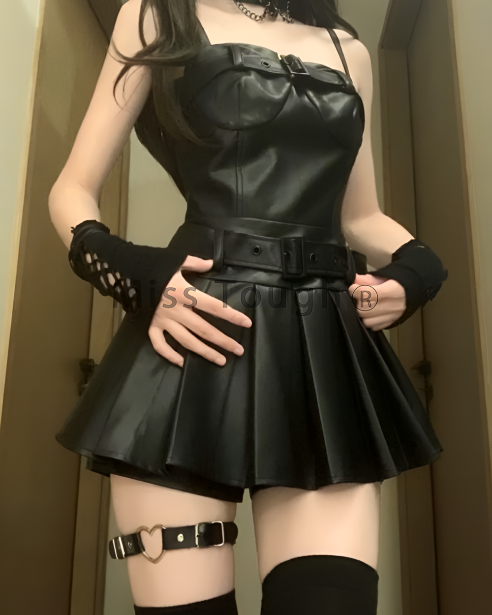 Korean-Style Vegan Leather Two Piece Set featuring a fitted top and skirt with a belt.