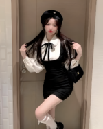 Model wearing a Korean preppy mini dress with a beret and bow tie.