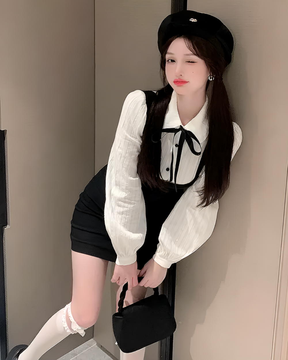Woman wearing a Korean preppy mini dress with a black skirt and matching hat.