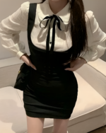 Black Korean preppy mini dress with a bib front and straps.