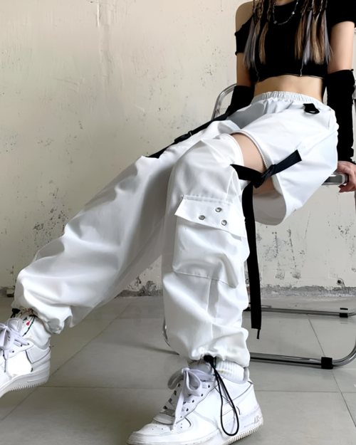 White Korean style cargo pants with detachable straps and multiple pockets.