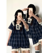 Two people posing with Korean style pajamas, featuring a blue plaid pattern and lace details.