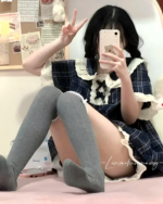 Grey Korean style pajamas featuring a plaid design and ruffled details.