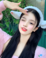 Woman wearing a fluffy white lamb ears headband. Cute lamb ears headband for a playful look.