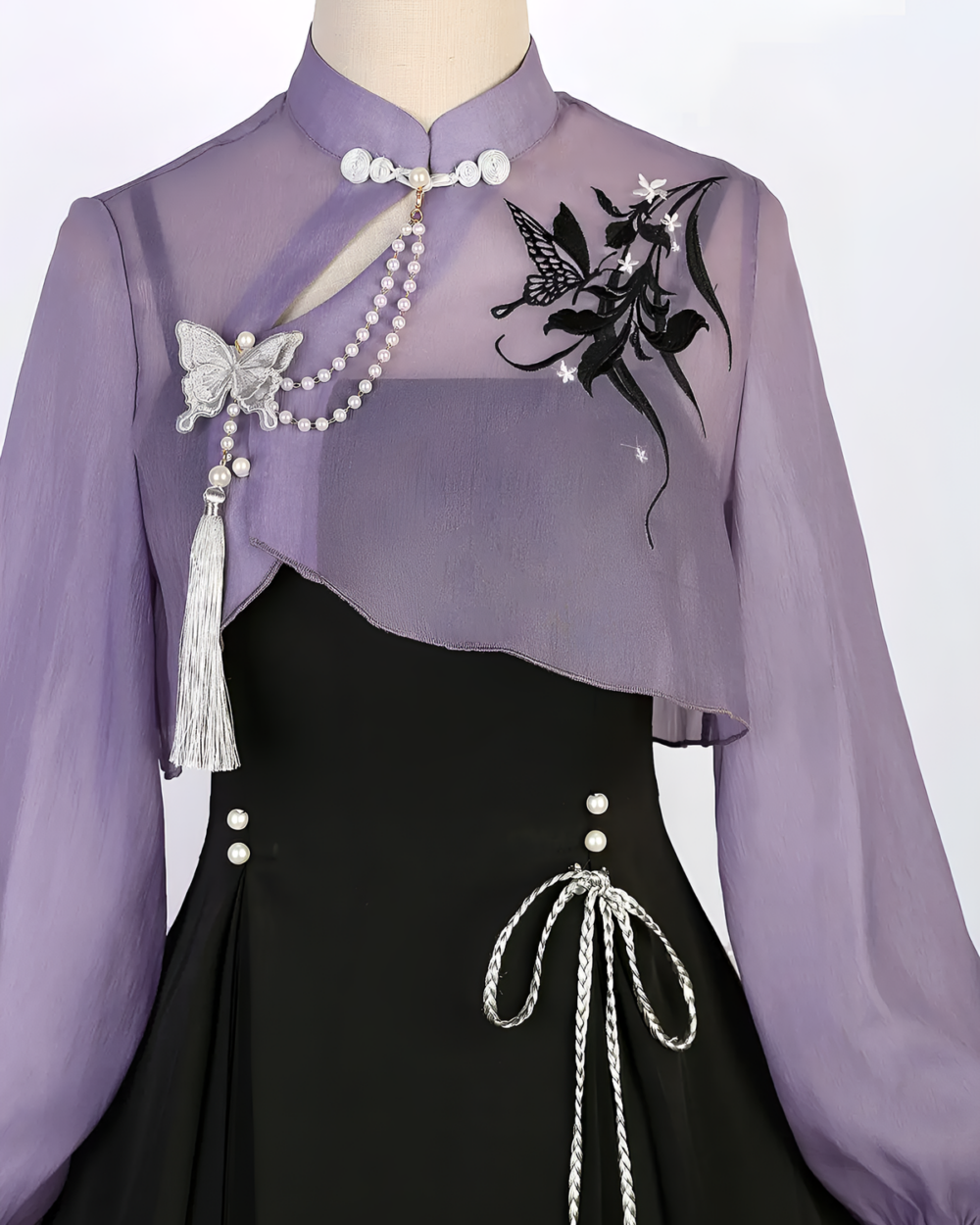 Lavender Qi Lolita outfit with sheer sleeves, butterfly embroidery, and a matching cape.