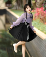 Model wearing a Lavender Set - Qi Lolita outfit, featuring a lilac blouse and pleated skirt.
