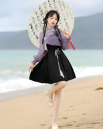Model wearing a Lavender Set - Qi Lolita outfit, featuring a black skirt, purple blouse, and umbrella.