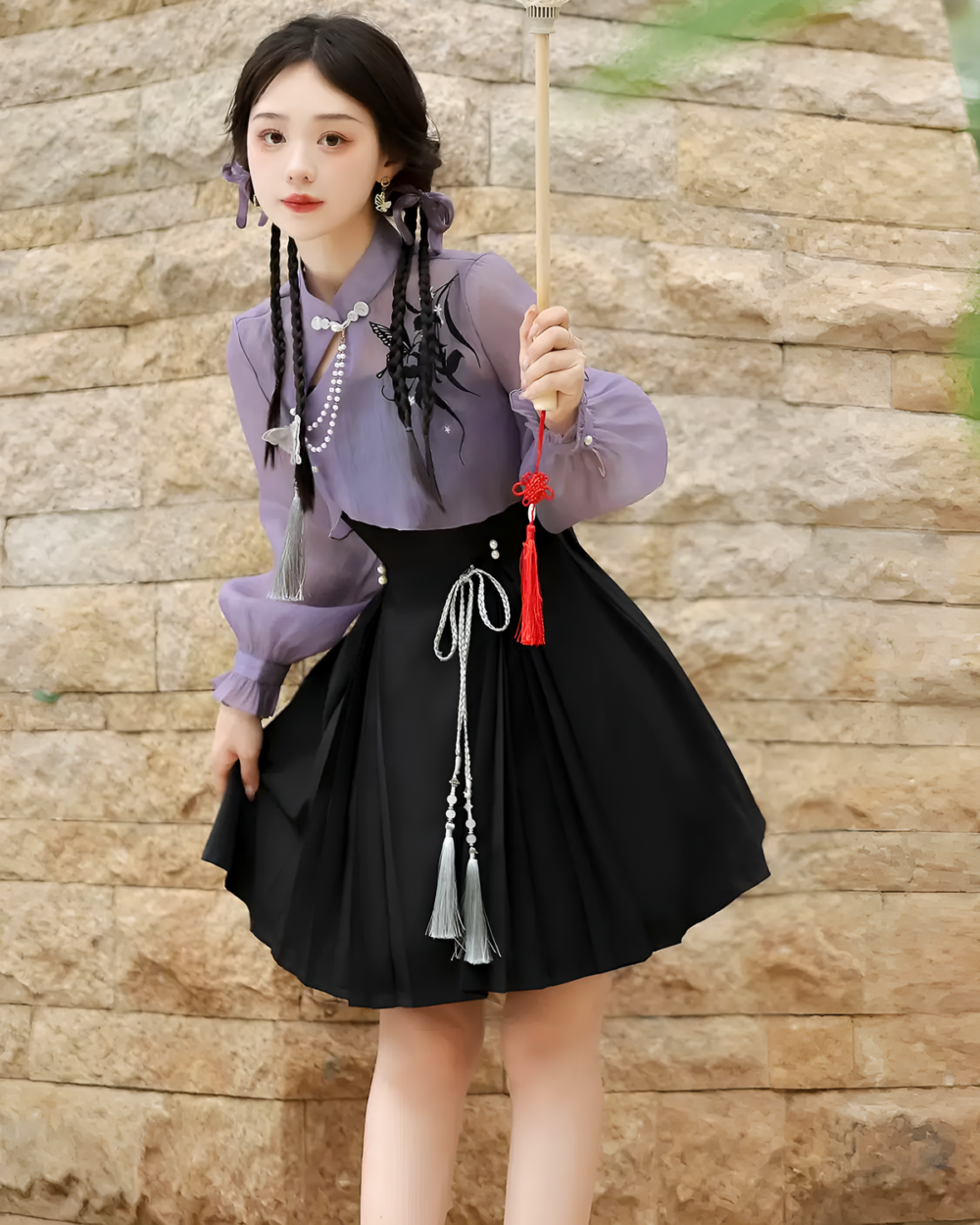 Model wearing a lavender Qi Lolita outfit, featuring a blouse and pleated skirt with tassels.