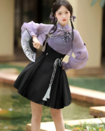 A woman wearing a Lavender Set - Qi Lolita outfit, featuring a purple blouse, skirt, and fan.