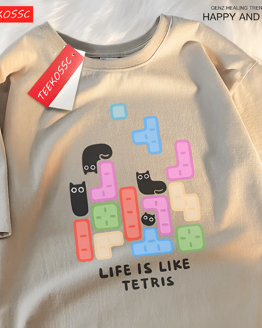 Life is Like Tetris Kuro Neko T-Shirt featuring falling Tetris blocks and black cats. A beige, casual Kuro Neko T-Shirt.