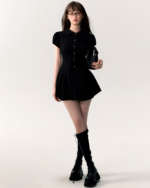 Black Literature Girl Mini Dress, a button-up academic aesthetic dress worn by a model.