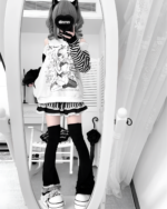 Model wearing a Long Sleeved Stripped T-Shirt - Yami Kawaii with a cute graphic print.