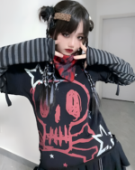 Black skull print shirt with long striped sleeves, featuring a detailed skull design.