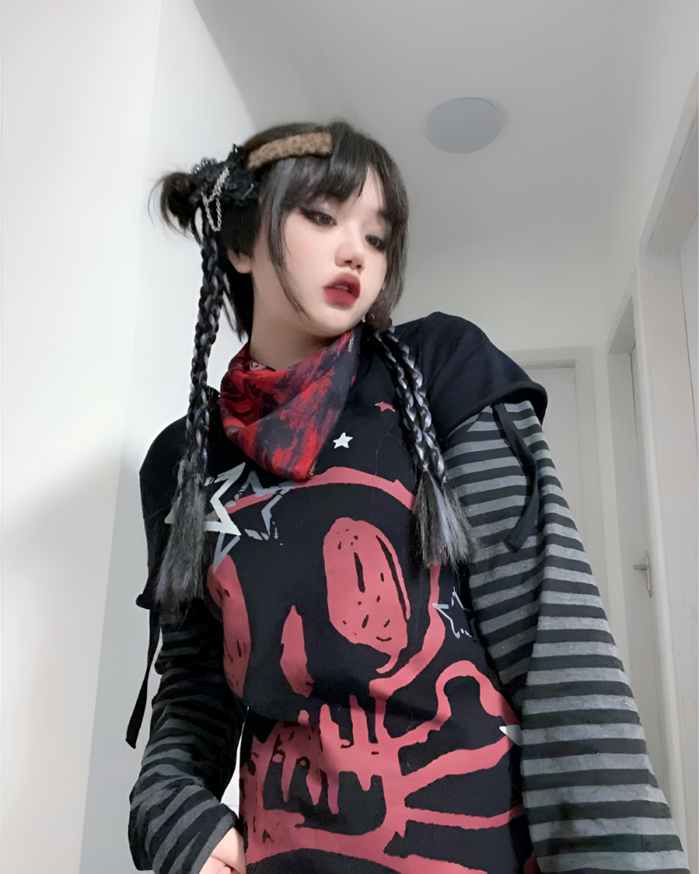 Model wearing a Long Stripped Sleeves Skull T-Shirt featuring a skull print.