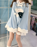 Blue Jojifuku hoodie featuring a plush bow and ruffled trim.