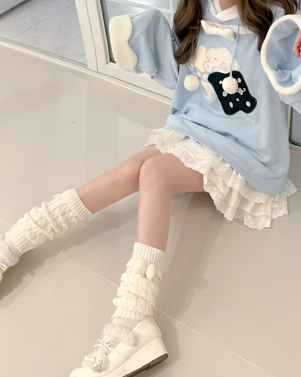 Jojifuku hoodie featuring a blue sweatshirt with a bear graphic and fluffy sleeves.