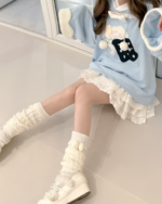 Jojifuku hoodie featuring a blue sweatshirt with a bear graphic and fluffy sleeves.