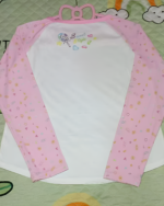 Pink and white long sleeve Mezzo Piano cake T-shirt with a cute cake and star pattern. Ideal for kids.