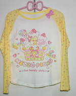 Mezzo Piano cake T-shirt, long sleeve, yellow with cake and character graphics. Perfect for lovely girls.