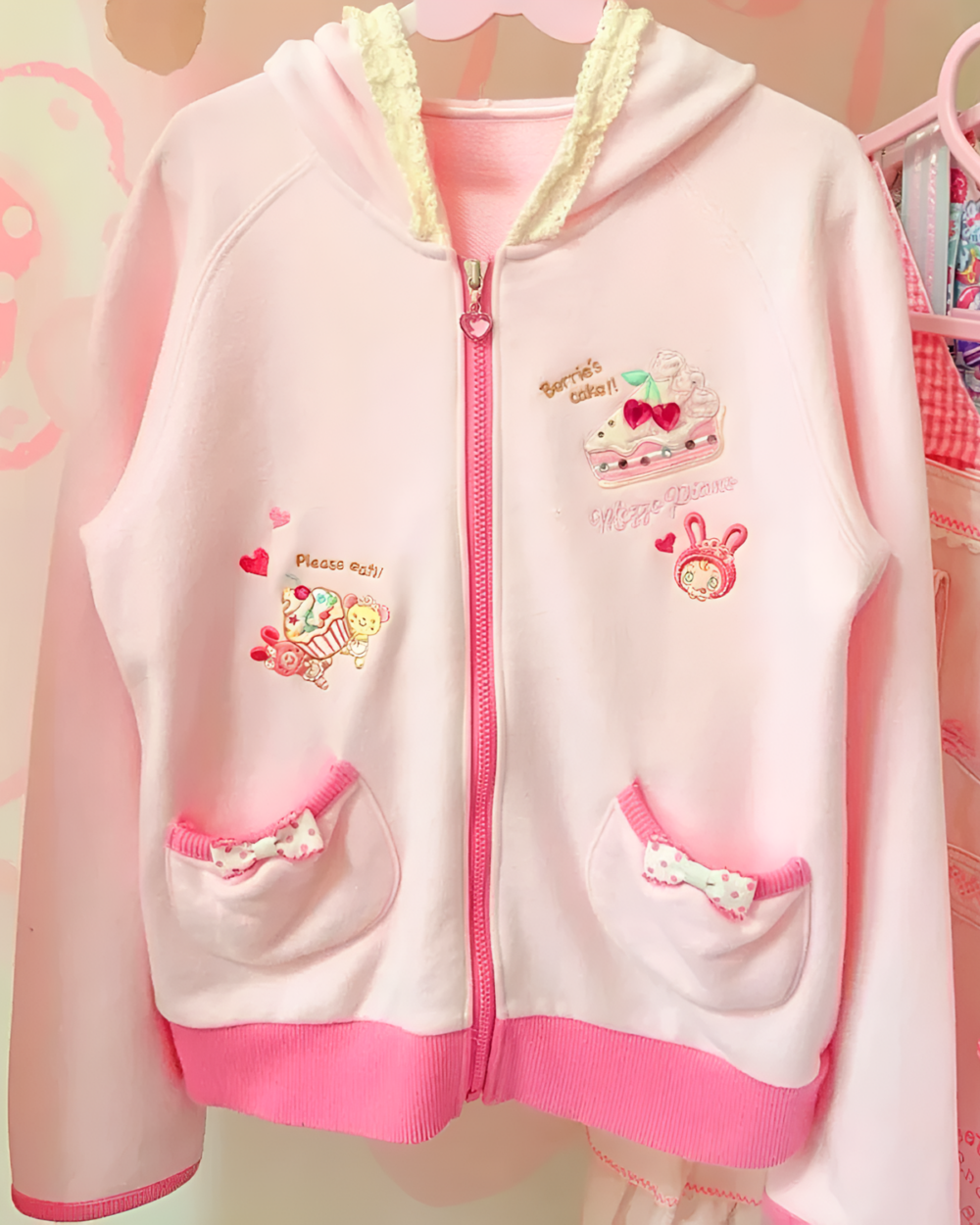 Pink Mezzo Piano hoodie with a Yume Kawaii aesthetic, featuring embroidered details and a zip-up front.