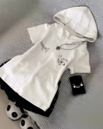 White Yami Kawaii hoodie with a zip-up front and black graphic details. A tag is visible next to the garment.