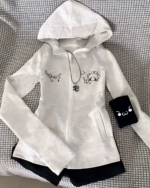 White zip-up hoodie with black accents and cat ears. Features a Yami Kawaii hoodie design with graphic prints.