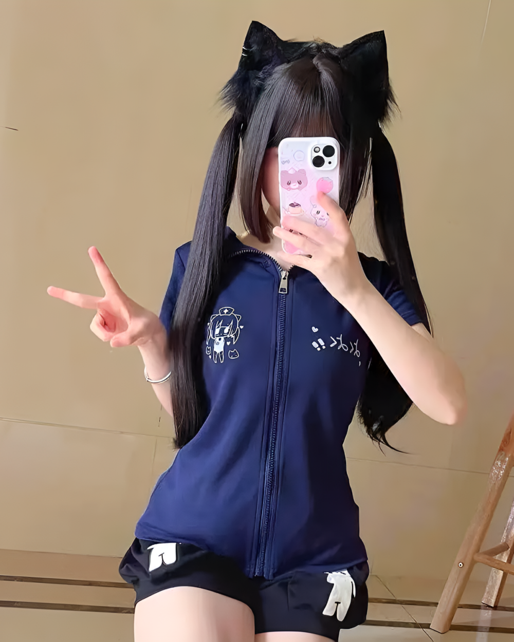 Woman modeling a navy blue Midnight Neko Zip Hoodie with cat ears, a Yami Kawaii hoodie design with graphics.
