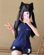 Woman modeling a navy blue Midnight Neko Zip Hoodie with cat ears, a Yami Kawaii hoodie design with graphics.