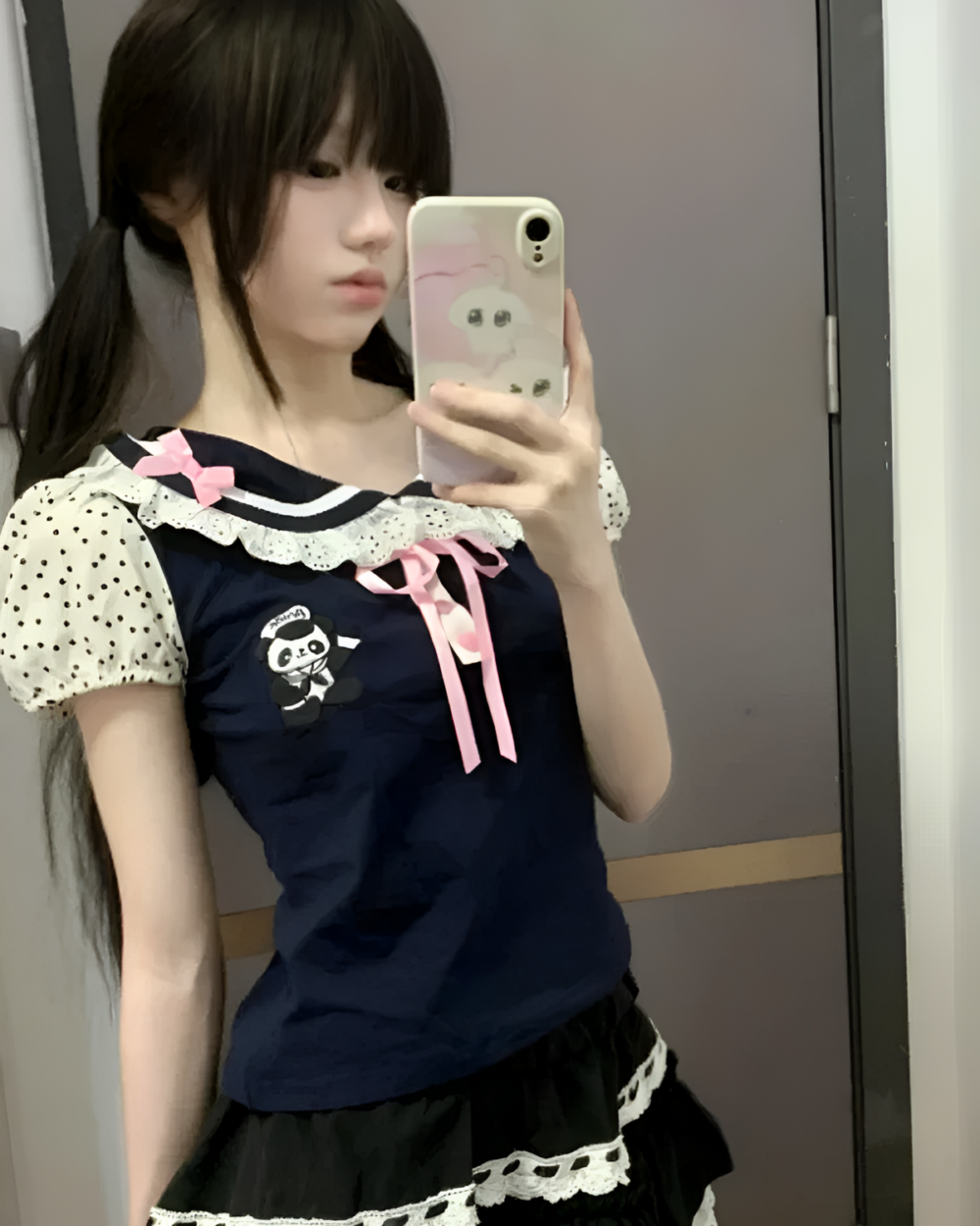 Woman wearing the Midnight Panda Sailor Tee, a navy blue short-sleeve shirt with a panda design and lace trim.