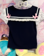 Midnight Panda Sailor Tee, a navy blue and white kawaii shirt with polka dot ruffled sleeves. Perfect for a cute, sailor-style look.