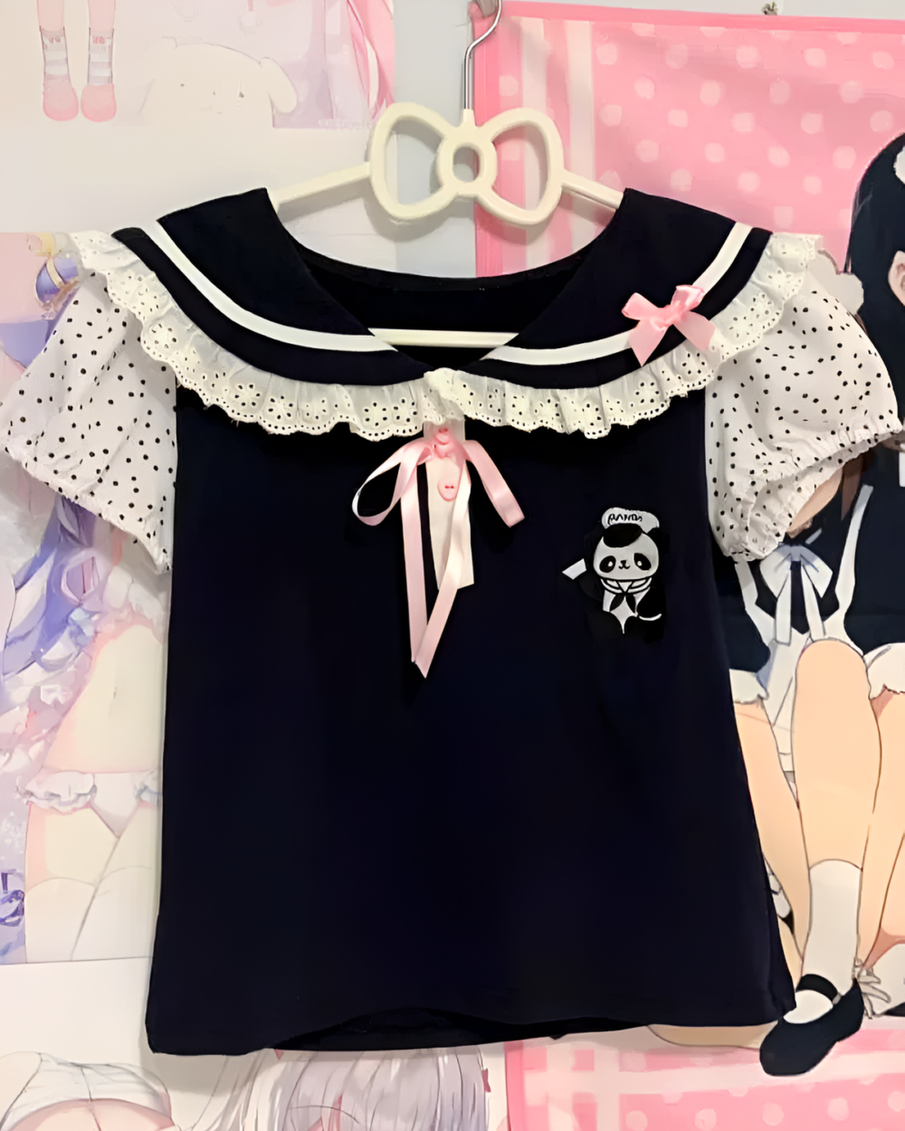 Midnight Panda Sailor Tee, a black kawaii t-shirt with a sailor collar and panda graphic. Pink bow detail.