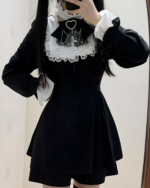 Black dress with white ruffled collar, embodying the Jirai Kei aesthetic. Long sleeves and a fitted silhouette.