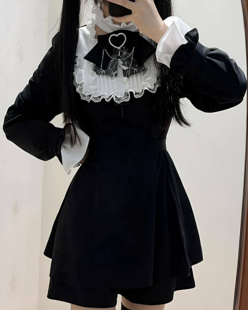 Black dress with white ruffled collar, embodying the Jirai Kei aesthetic. Long sleeves and a fitted silhouette.