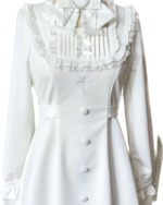 White long sleeve dress with ruffled details, embodying the Jirai Kei aesthetic. Features a cross pendant and button-up design.