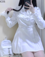 White ruffled coord outfit, showcasing the Jirai Kei aesthetic. Includes a collared shirt and mini skirt.