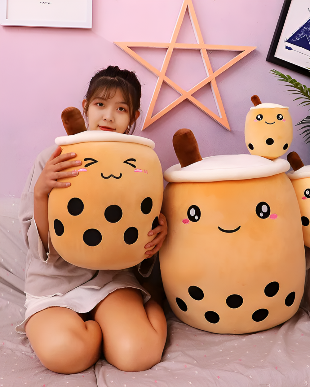 Two Milk Tea Plushies MK II - Boba Overload plush toys, one held by a child.
