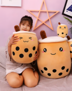 Two Milk Tea Plushies MK II - Boba Overload plush toys, one held by a child.