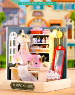 Detailed Miniature DIY Doll House featuring a sewing station with fabric, machine, and accessories.