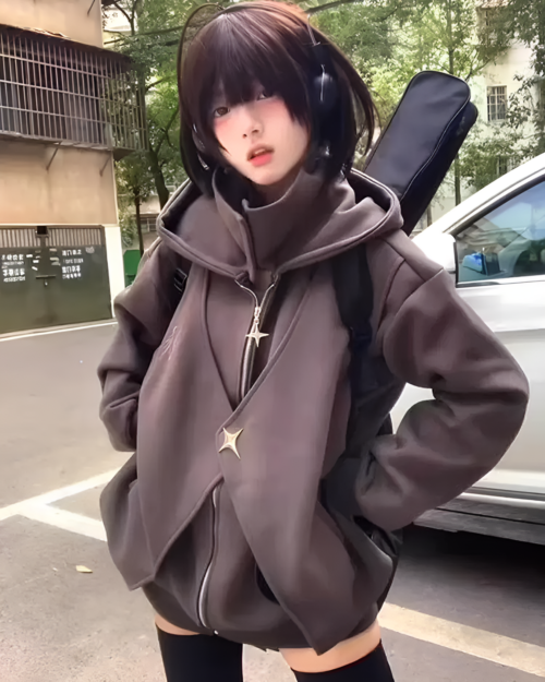 Woman wearing a gray Moonlight Zipper Hoodie outdoors. The hoodie has a front zipper and a star-shaped detail.