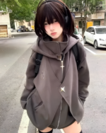 Woman wearing a gray Moonlight Zipper Hoodie outdoors. The hoodie features a zipper closure and a relaxed fit.