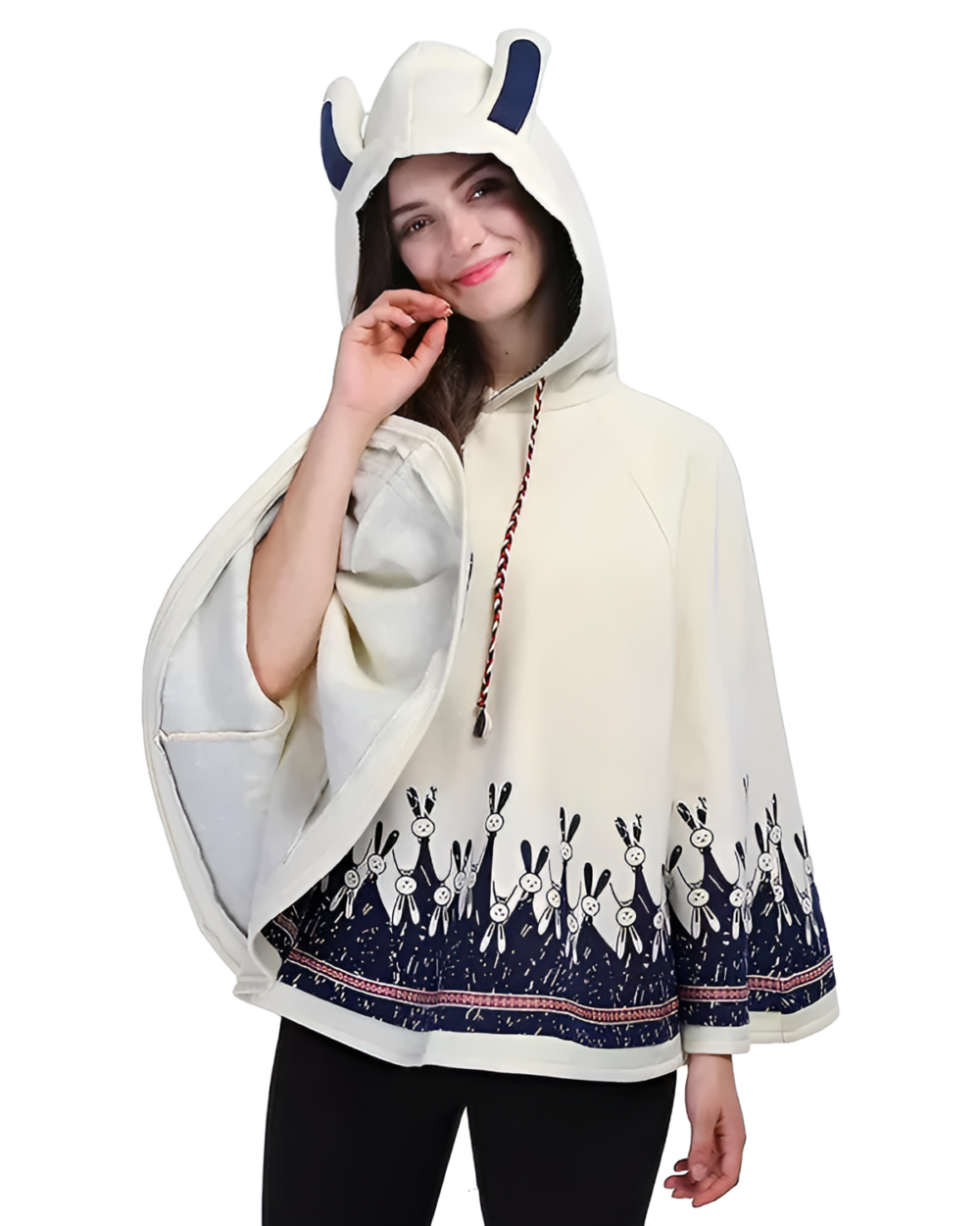 Woman wearing a cream bunny fleece cape with a bunny print and hood. Stylish and comfortable outerwear.