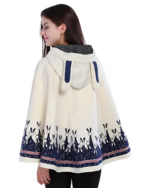 Woman wearing a white Moonlit Bunny Fleece Cape with blue bunny details. A cozy bunny fleece cape with a hood and patterned hem.