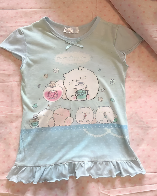 Light blue Necolon T-Shirt featuring cute, cartoon characters and a ruffled hem.