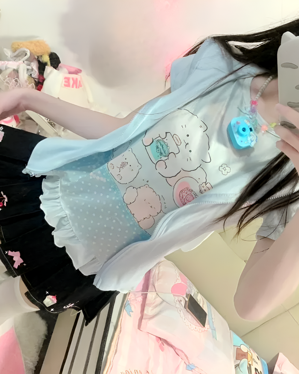 A person wearing a blue Necolon T-Shirt featuring a cute kawaii character design.