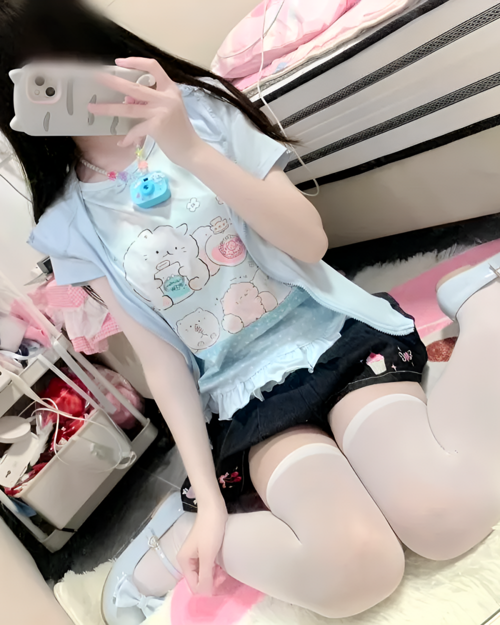 Blue Necolon T-Shirt featuring cute animal characters, worn by a person.