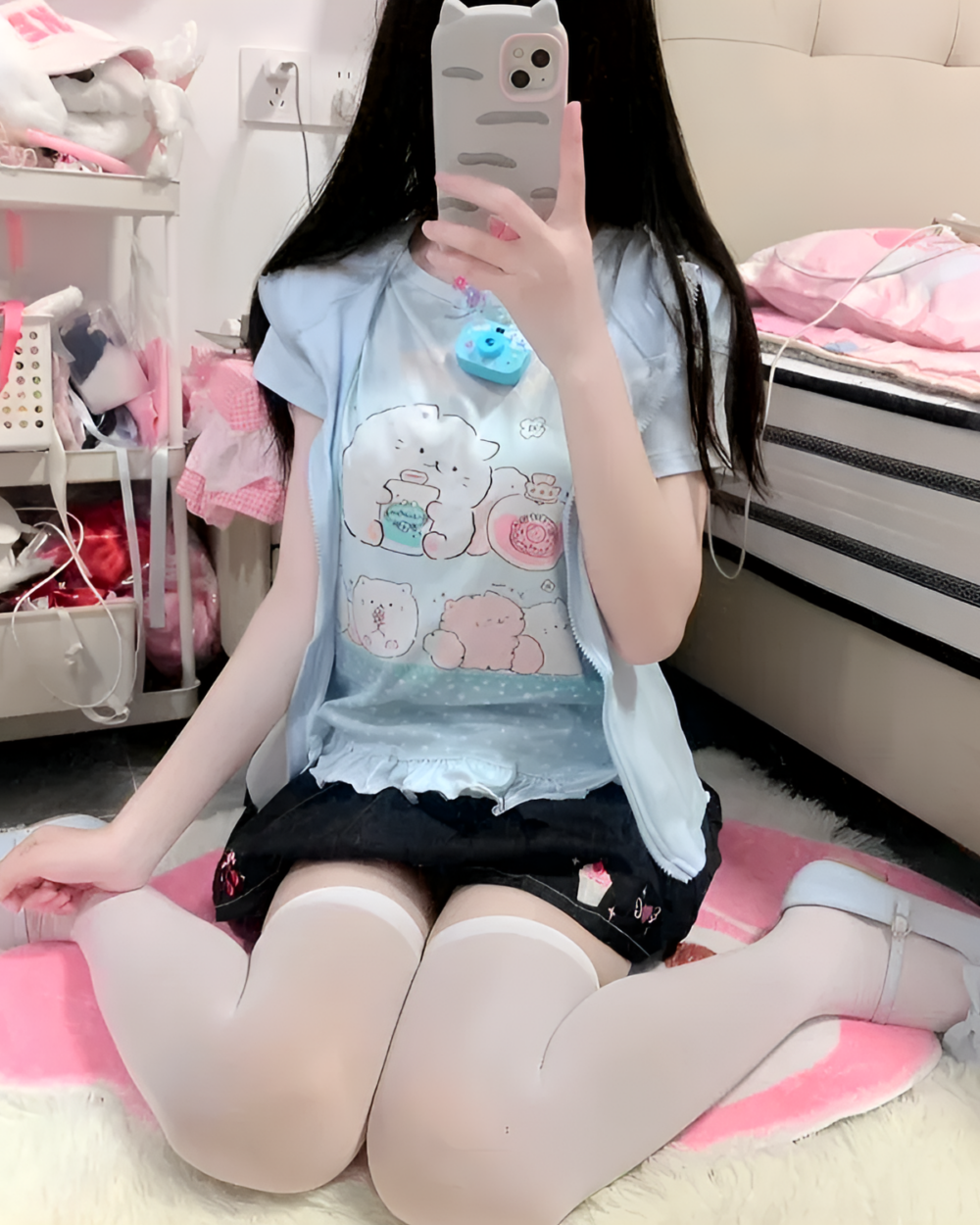 A person wearing a blue Necolon T-Shirt featuring Yume Kawaii characters.
