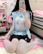 A person wearing a blue Necolon T-Shirt featuring Yume Kawaii characters.