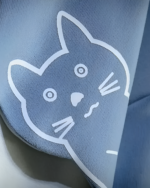 Close-up of the Neko Sensei Pullover Hoodie showing a cat face graphic detail in white on light blue fabric.